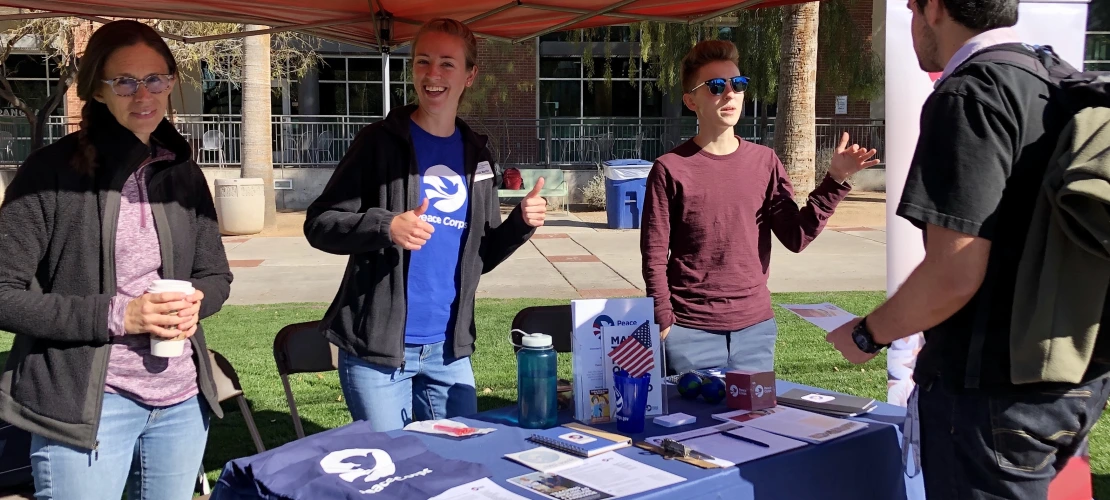 Hannah Martin, UArizona Peace Corps Recruiter, tables at National Peace Corps Week 2020