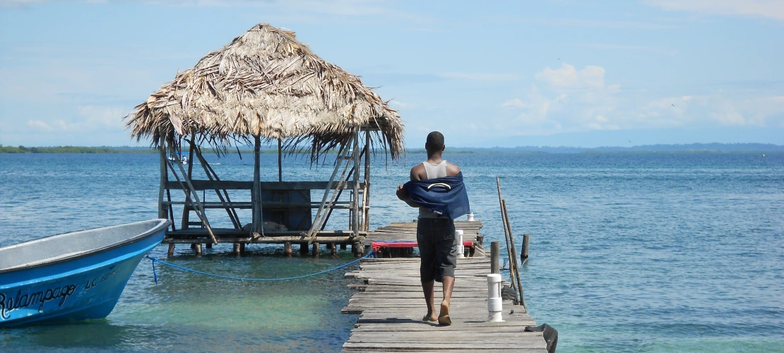 Man walking on dock, Bocas del Toro island visit 2012, Jacy Woodruff, Peace Corps Panama
