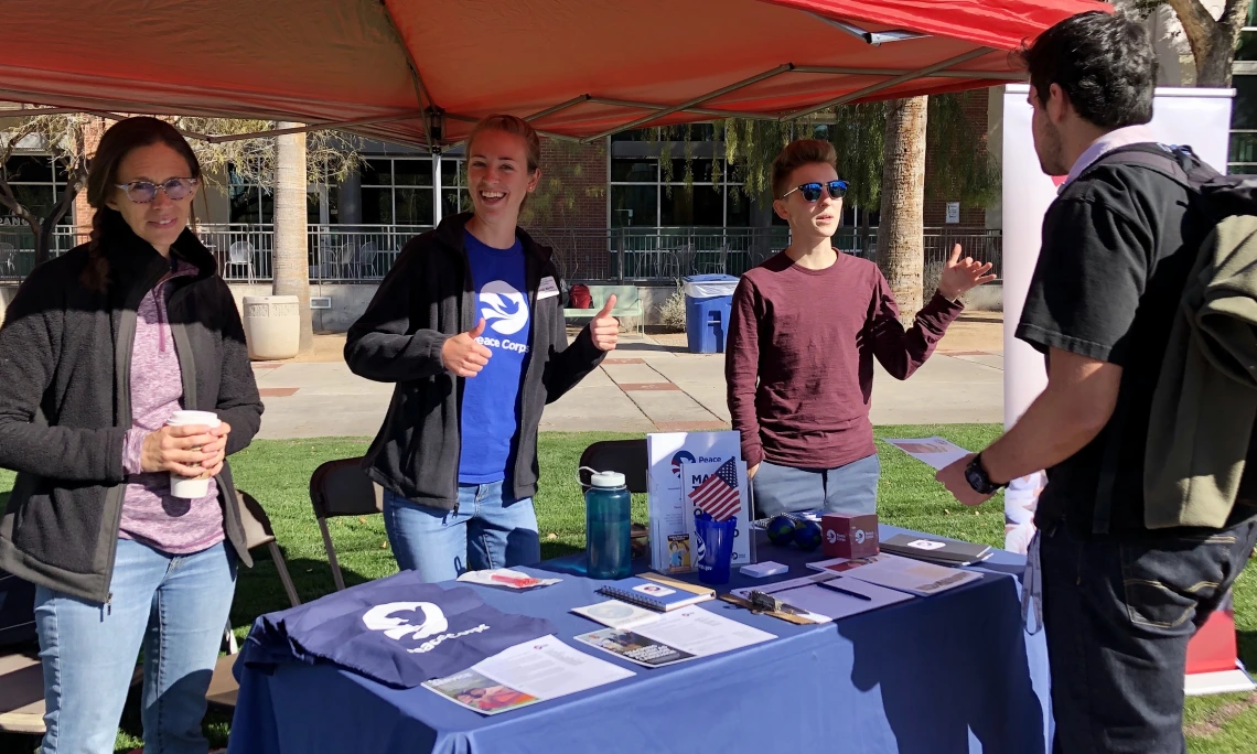 Hannah Martin, UArizona Peace Corps Recruiter, tables at National Peace Corps Week 2020