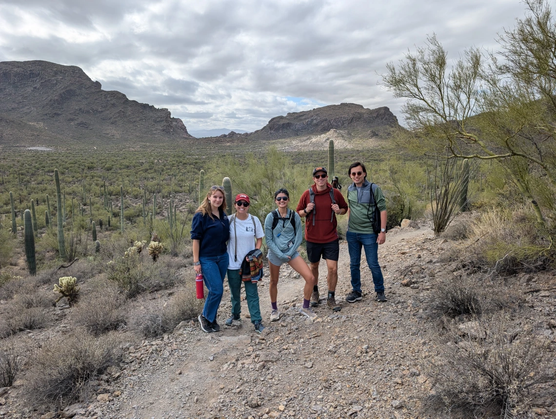 Peace Corps Prep students and Returned Peace Corps Volunteers posing for a picture on the trail of a hike in November of 2025