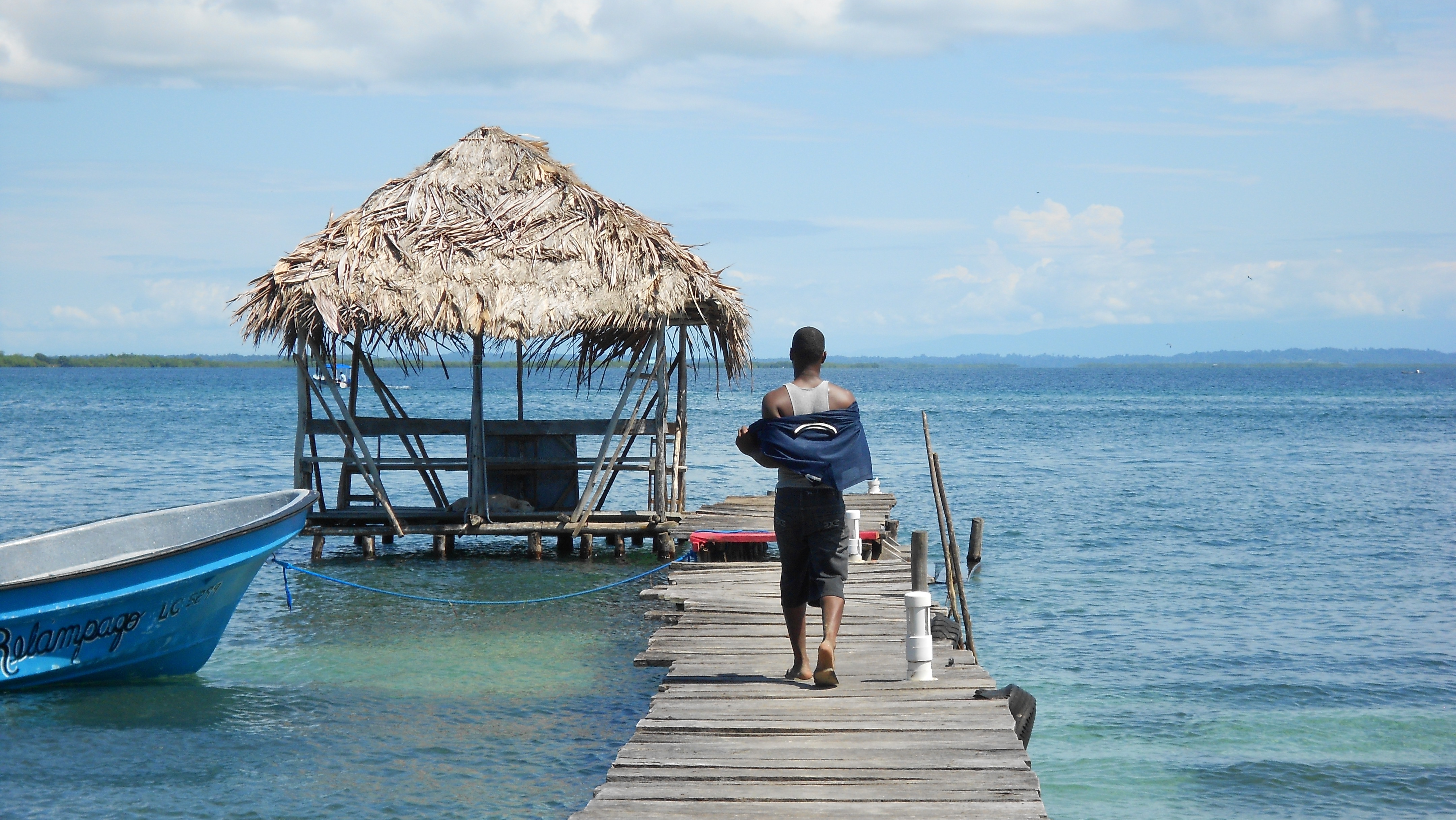 Man walking on dock, Bocas del Toro island visit 2012, Jacy Woodruff, Peace Corps Panama