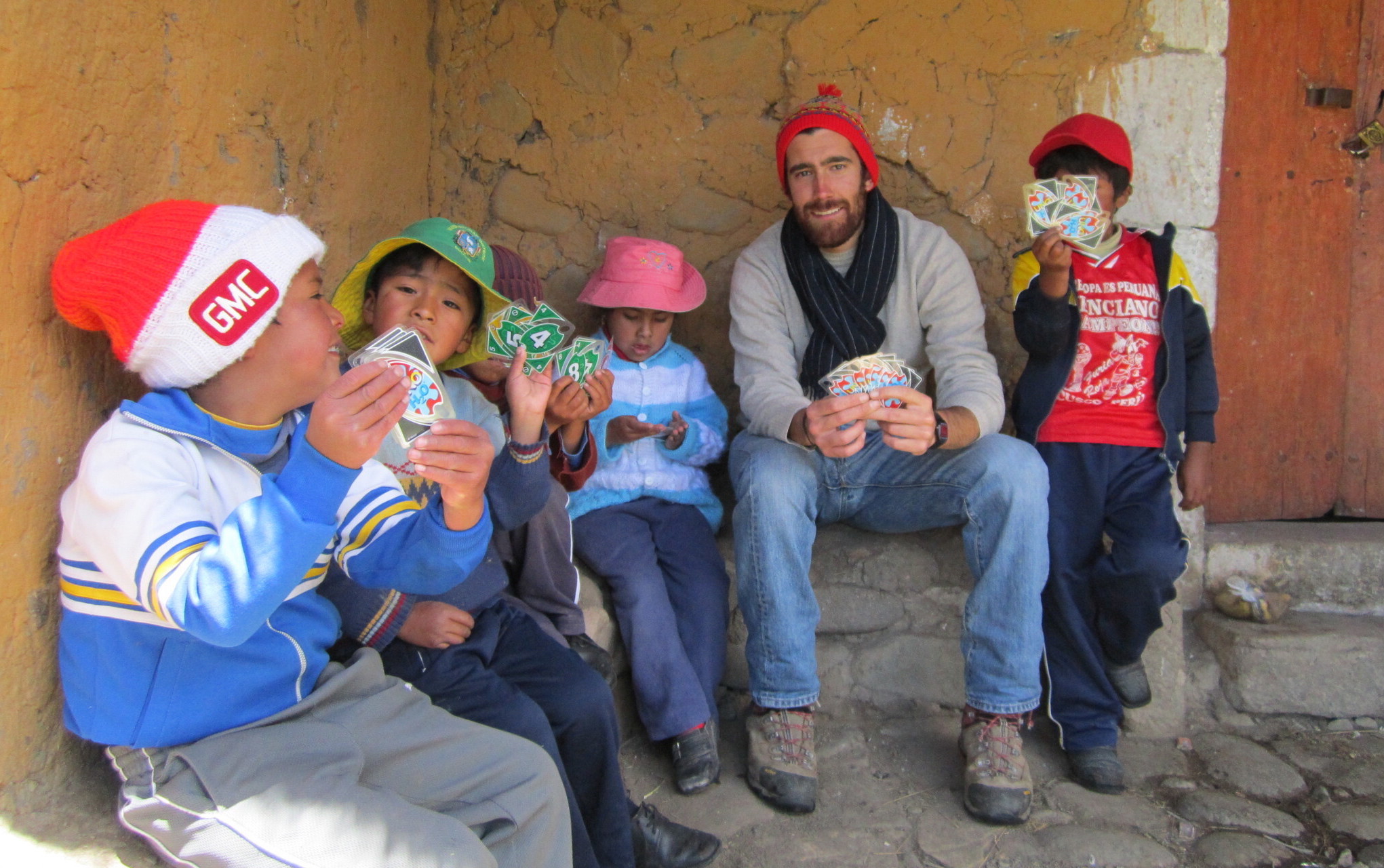Mario playing cards with kids, Mario Nuño-Whelan, Peace Corps Peru